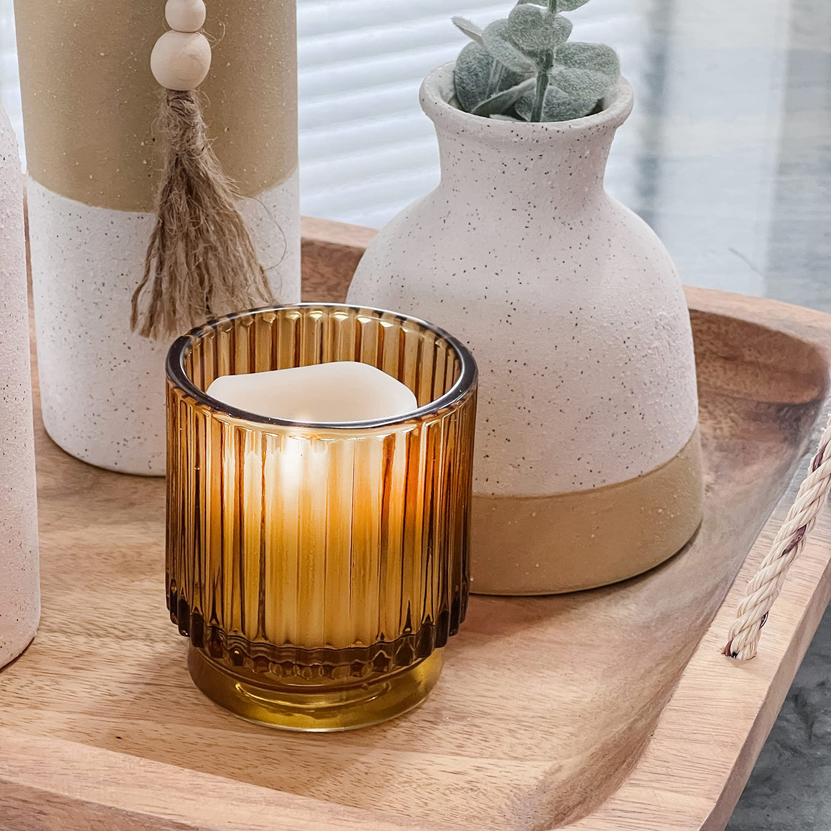 Kate Aspen wedding table decor with amber votive holders for rustic charm
