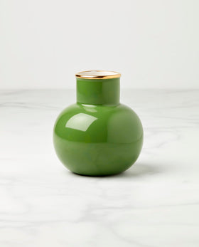 kate spade new york green vase close-up shows sleek porcelain and color.