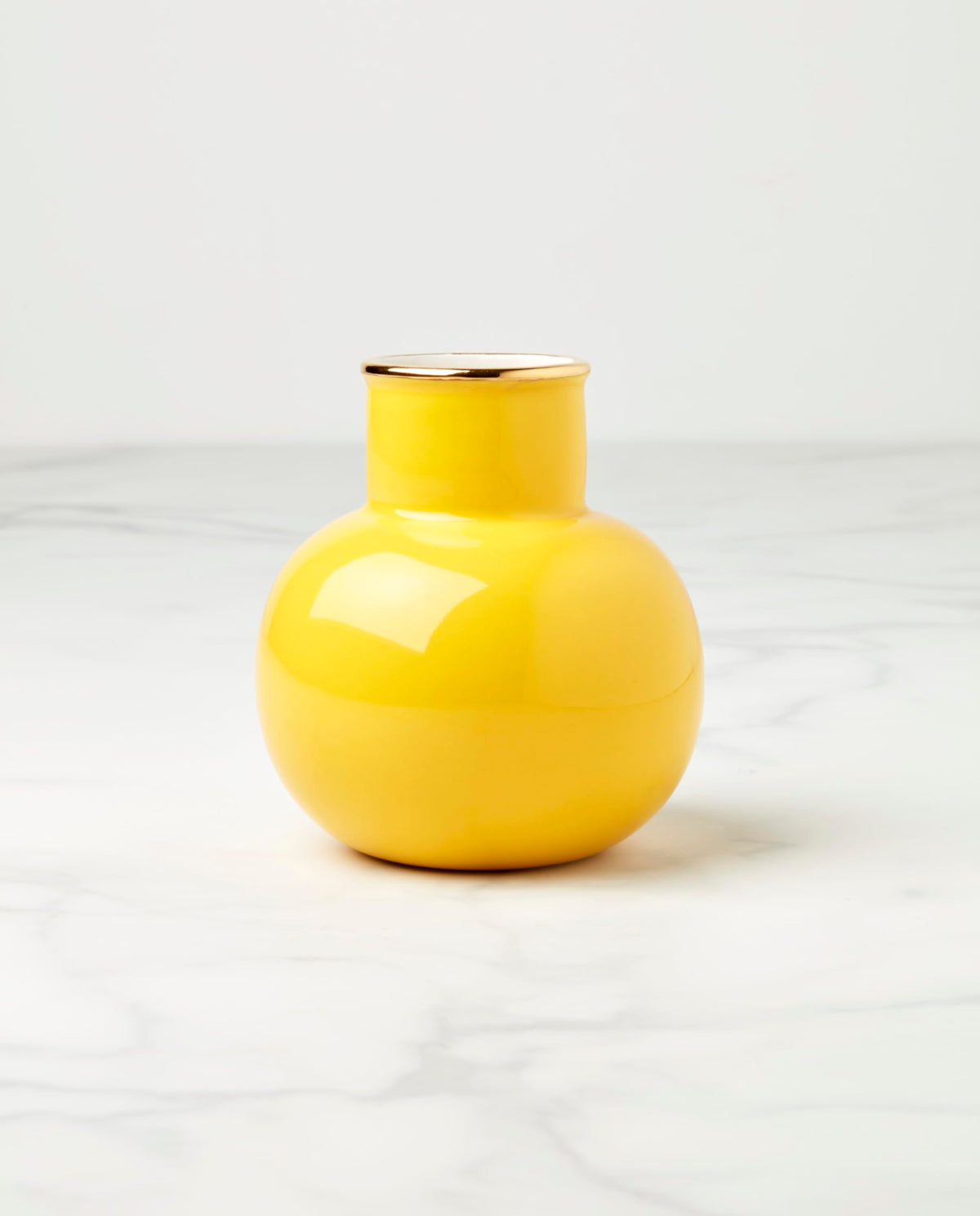 Kate Spade New York yellow vase closeup shows glossy porcelain and sunny color