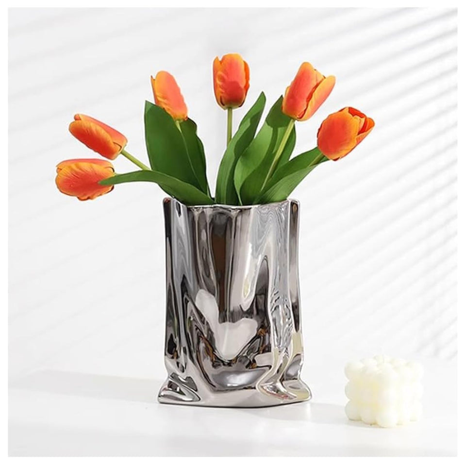 Katoonx ceramic silver flower vase on a modern living room table