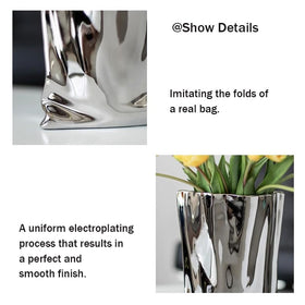 Katoonx silver metal finish vase gleams under light