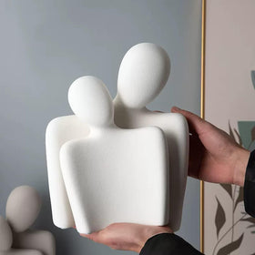 Katoonx white ceramic couple figurine detail adds minimalist shelf art.