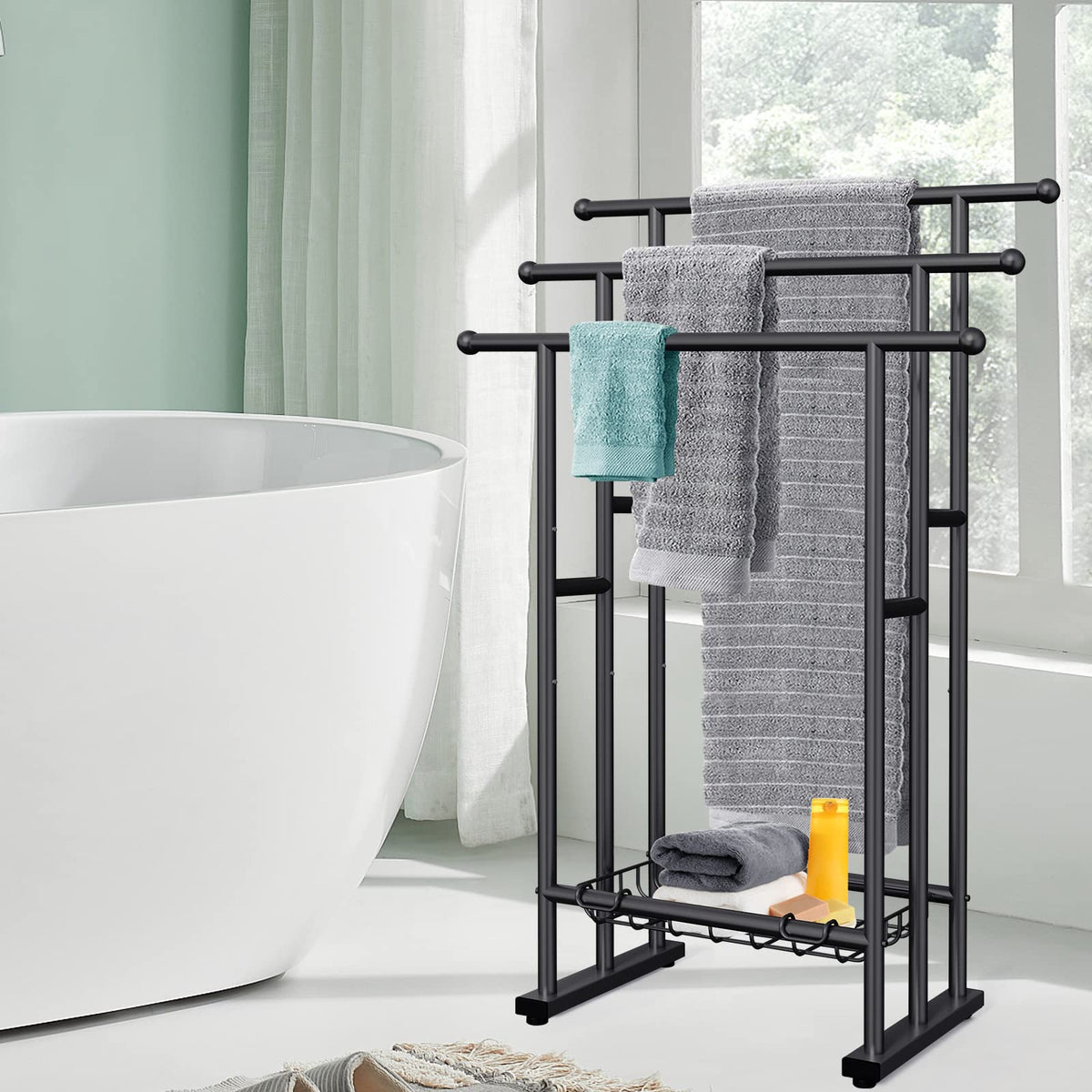 Kayfia 3-tier towel rack with basket detail for toiletries.