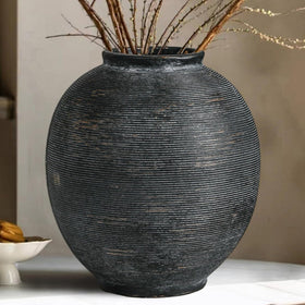 Kayolin black ceramic vase with textured finish, ideal as a centerpiece.