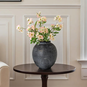Kayolin vase on mantel display with accents.