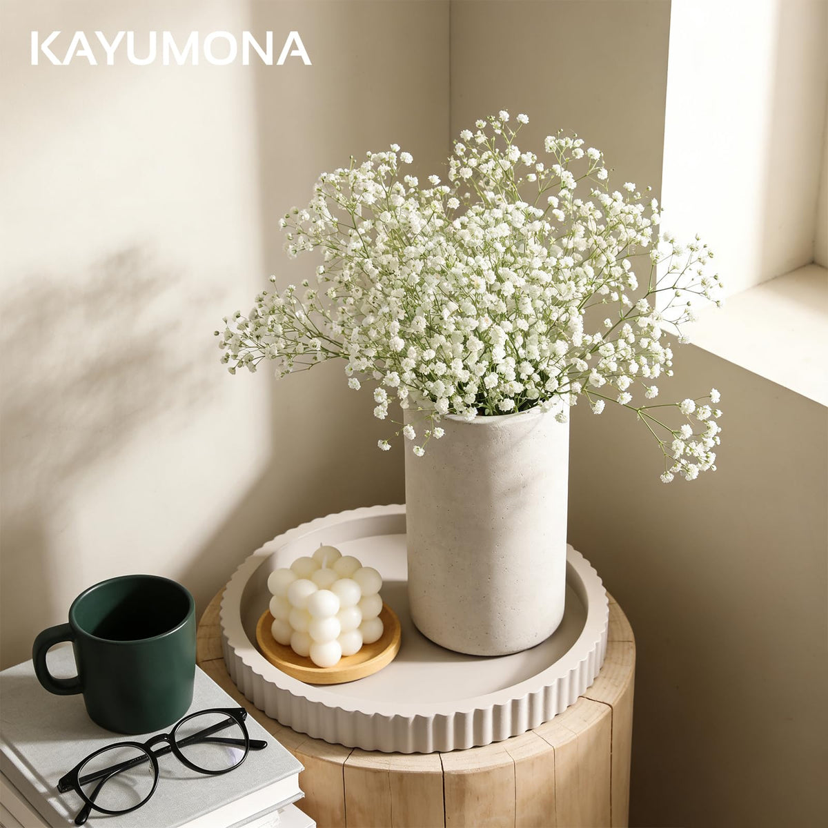 Kayumona tray as a centerpiece anchors decor with minimalist elegance