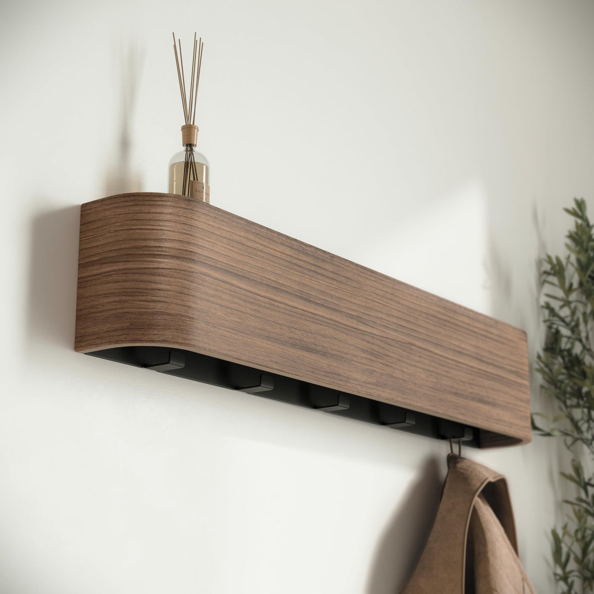 Kazai Toke keeps jackets and bags within reach in busy entryways.