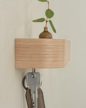 Kazai Toke entryway organizer on wall demonstrates minimalist design.