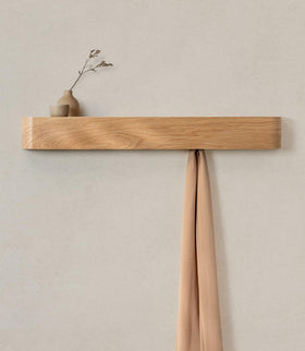 Kazai Toke wall-mounted coat rack with sleek design and space-saving entryway storage.
