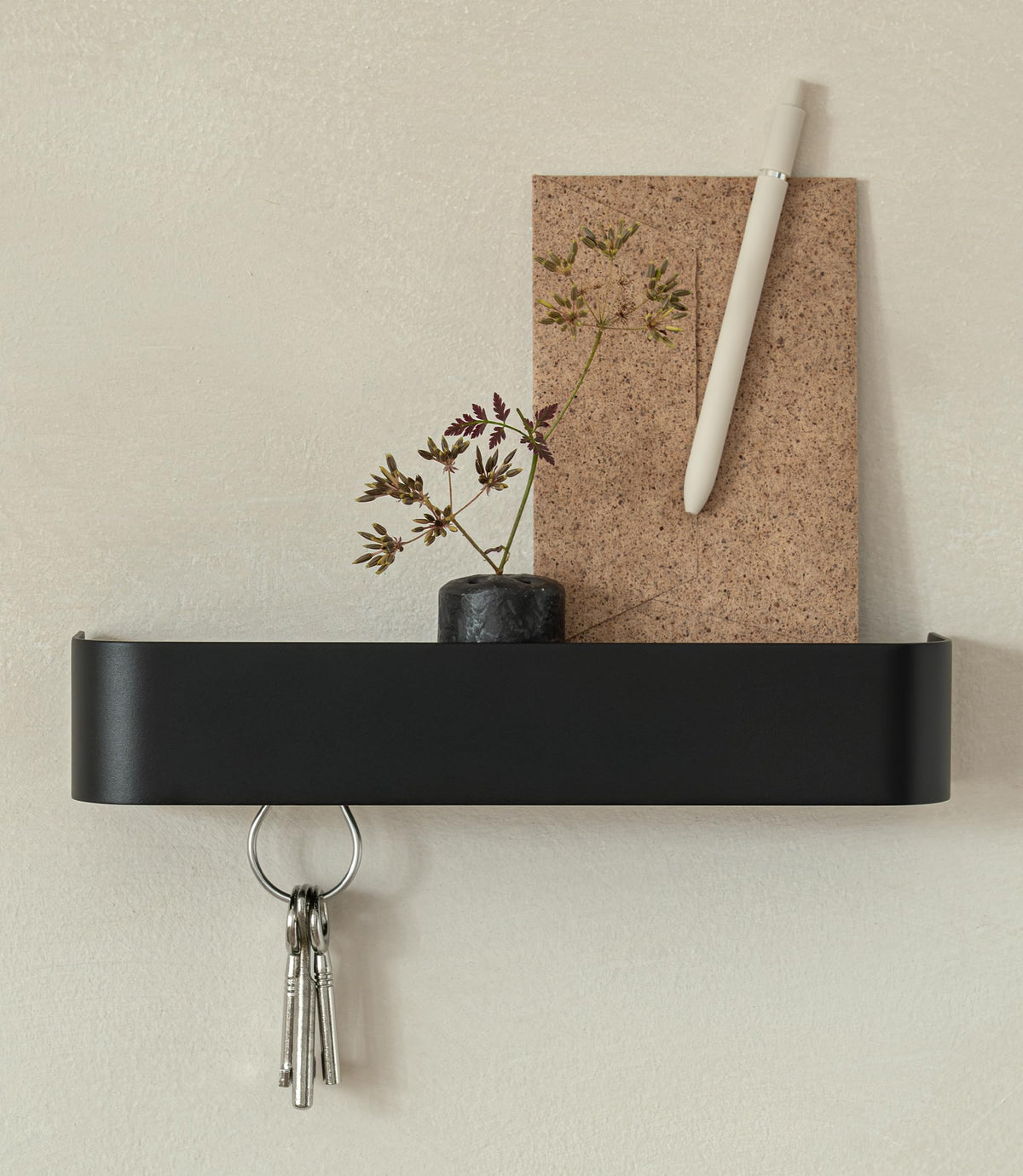 Kazai Tone wall key hanger with integrated shelf keeps essentials organized.