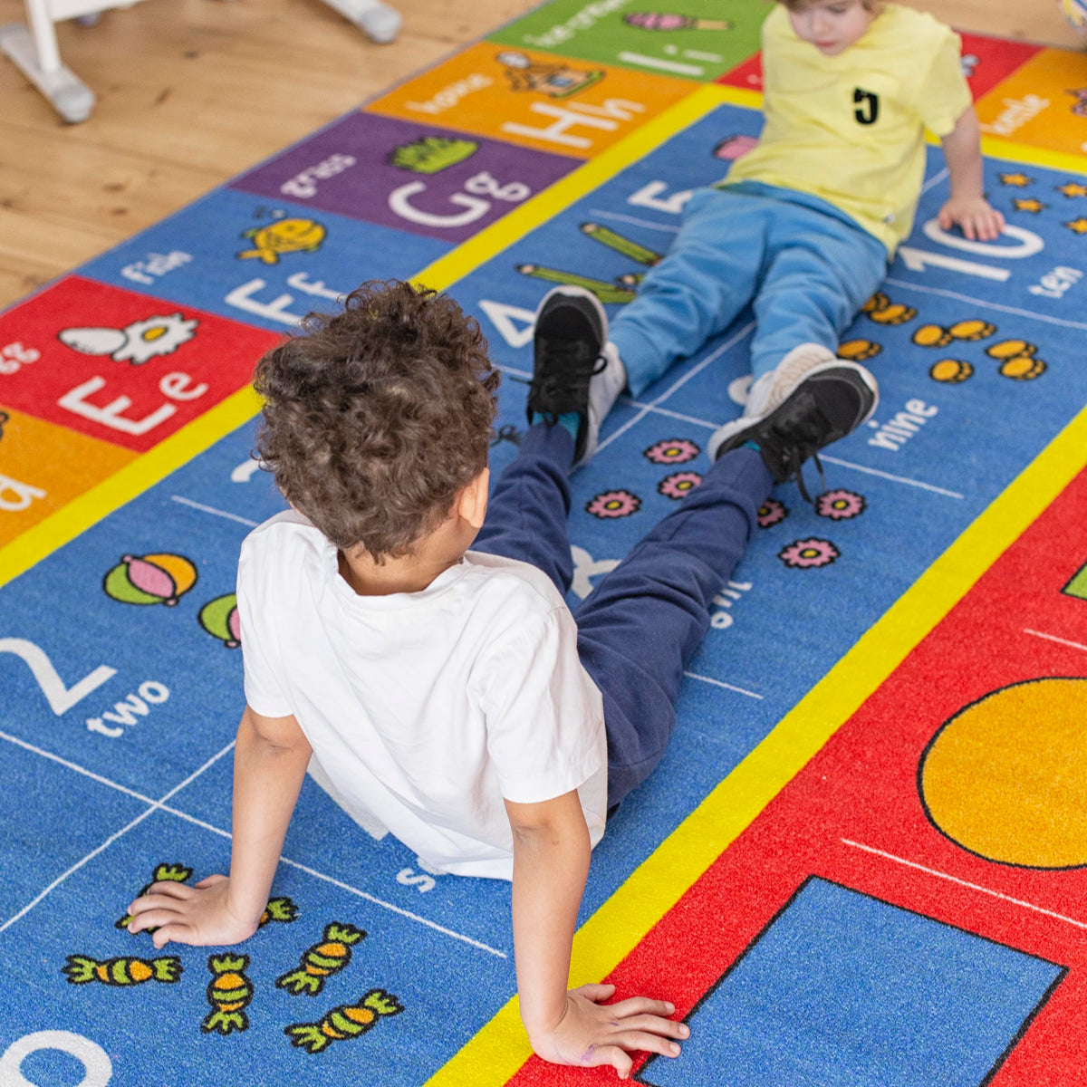 KC Cubs shapes rug featuring geometry icons to boost shape recognition during activity.