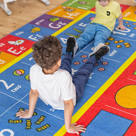 KC Cubs shapes rug featuring geometry icons to boost shape recognition during activity.