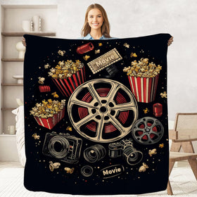 Keepitcozi Movie Ticket Popcorn Throw Blanket on sofa for cozy movie nights.