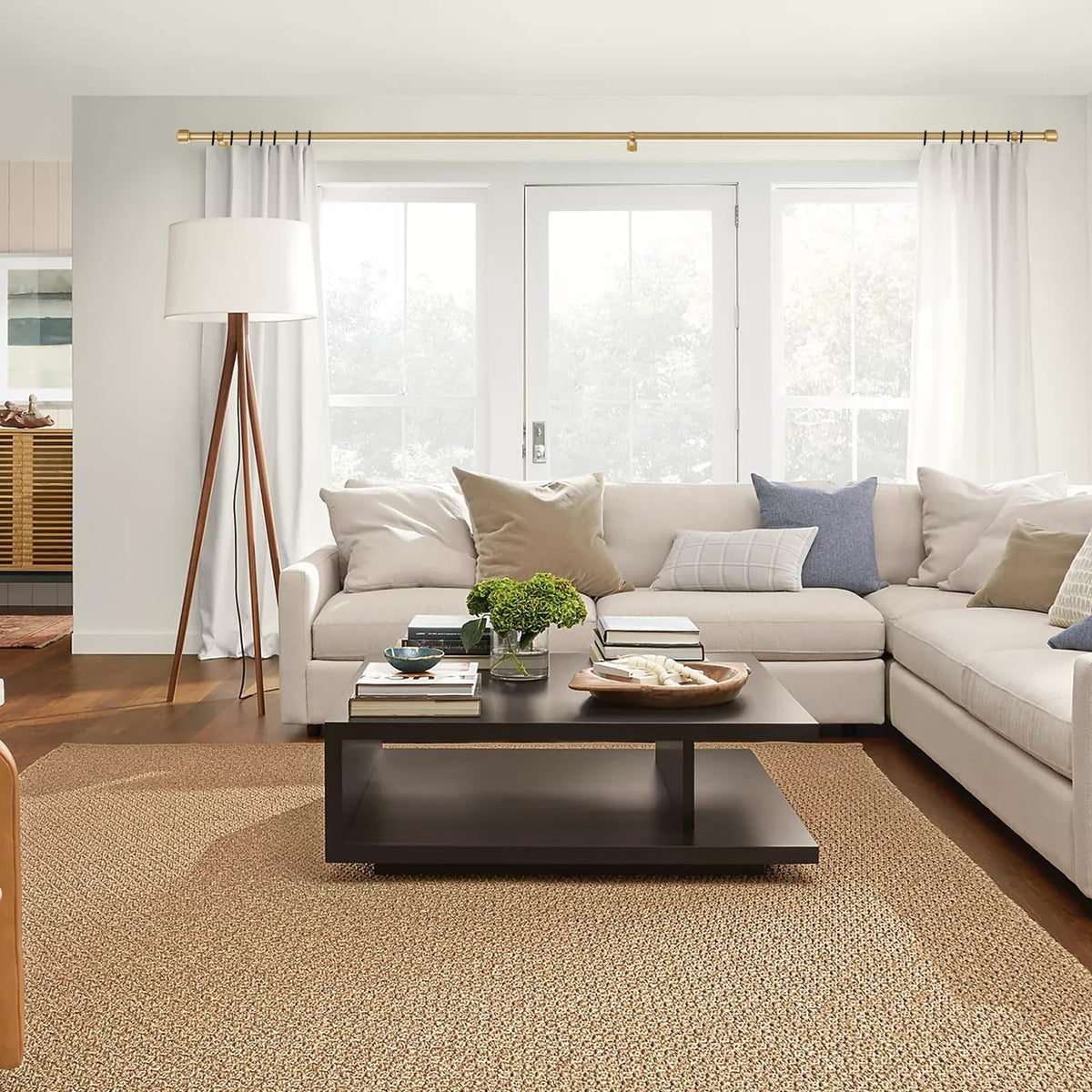 Kemmie curtain rods with telescoping sections illustrate easy length adjustment for different window sizes.