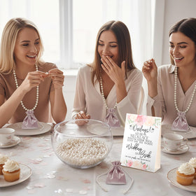Kenning durable plastic pearl necklaces serve as lightweight favors.