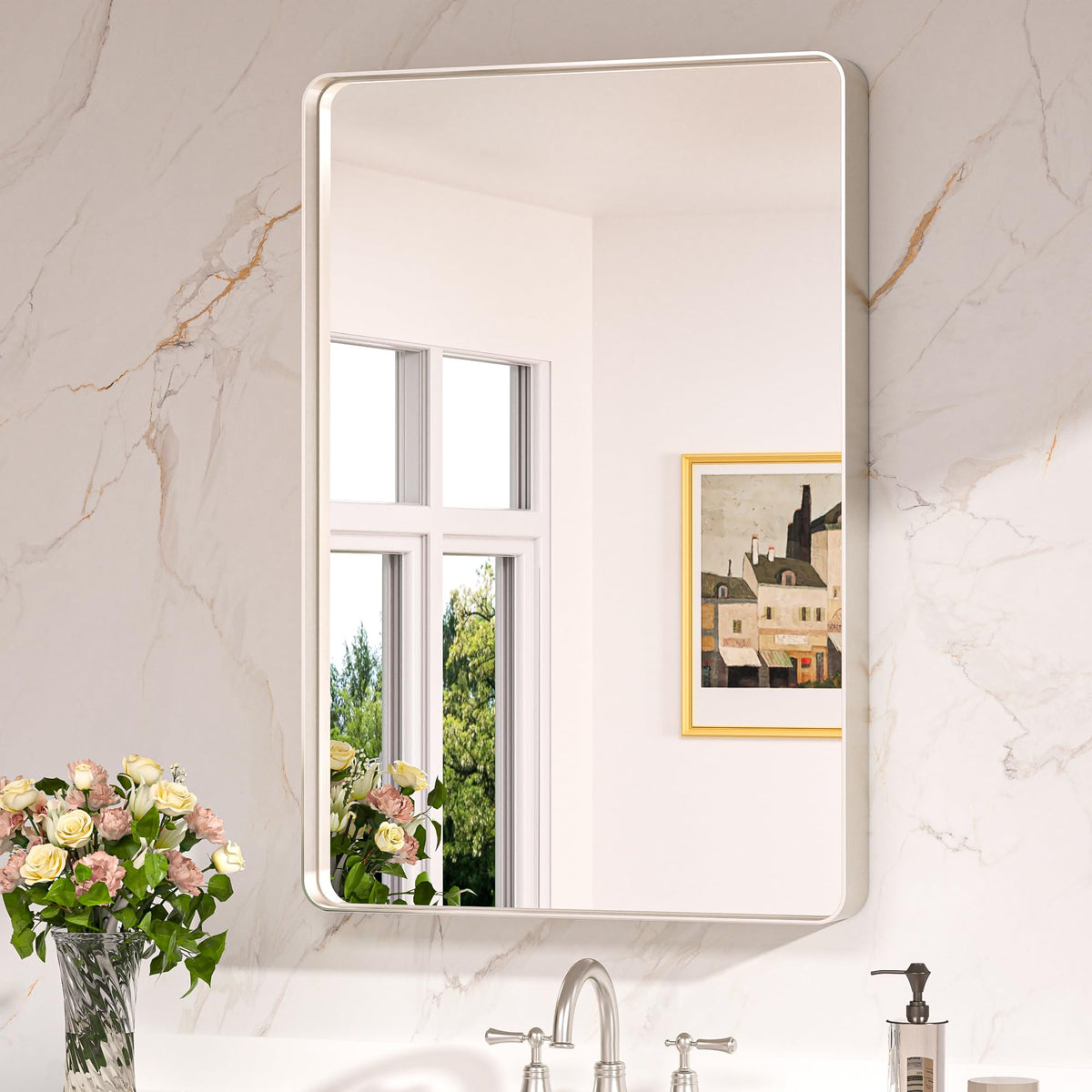 Keonjinn brushed nickel mirror with rounded frame above the sink for a sleek bathroom focal point.