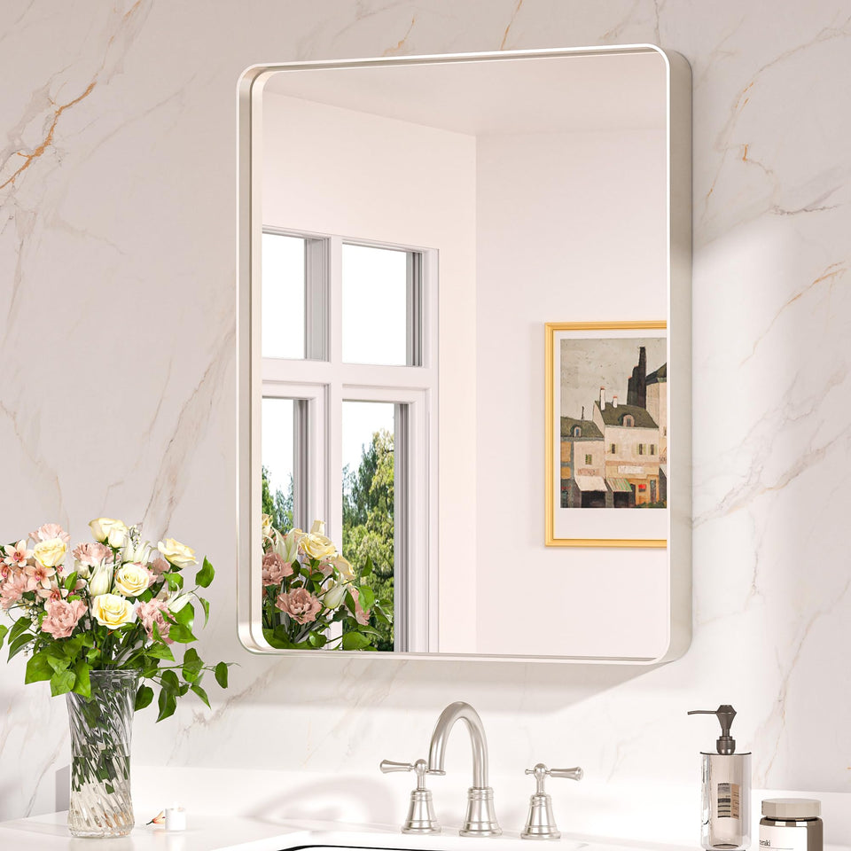 Keonjinn rounded metal frame mirror over sink adds a modern focal point for bathrooms