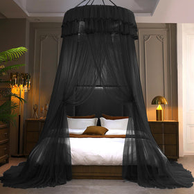 Kertnic black canopy over a king bed for dramatic style and protection.