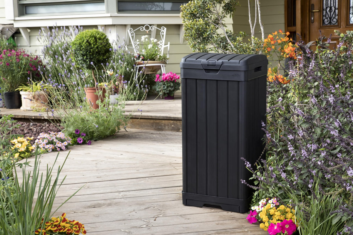 Keter Baltimore 34.4 inch tall black trash can on patio