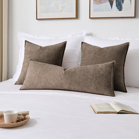 Kevin Textile decorative pillow on sofa showcases modern farmhouse style.