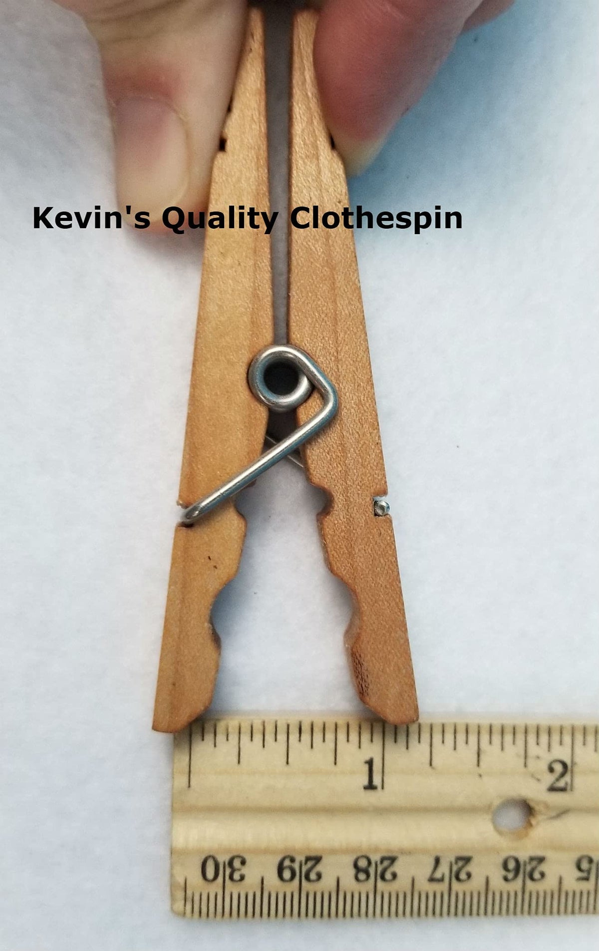 Kevin's Quality Clothespins on clothesline demonstrating secure hold in breezy weather