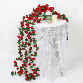 KHOYIME red rose garland draped on a chair for whimsical decor