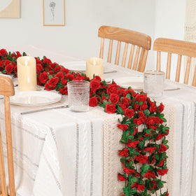 KHOYIME red rose garland used as a wall backdrop with vibrant color