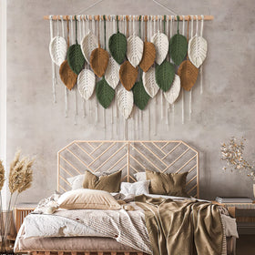 Khoyime leaf tassel decor hangs above beds or sofas, creating a boho focal point.