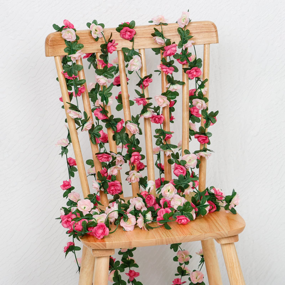 KHOYIME table decoration garland brightens centerpieces with soft pink blooms.
