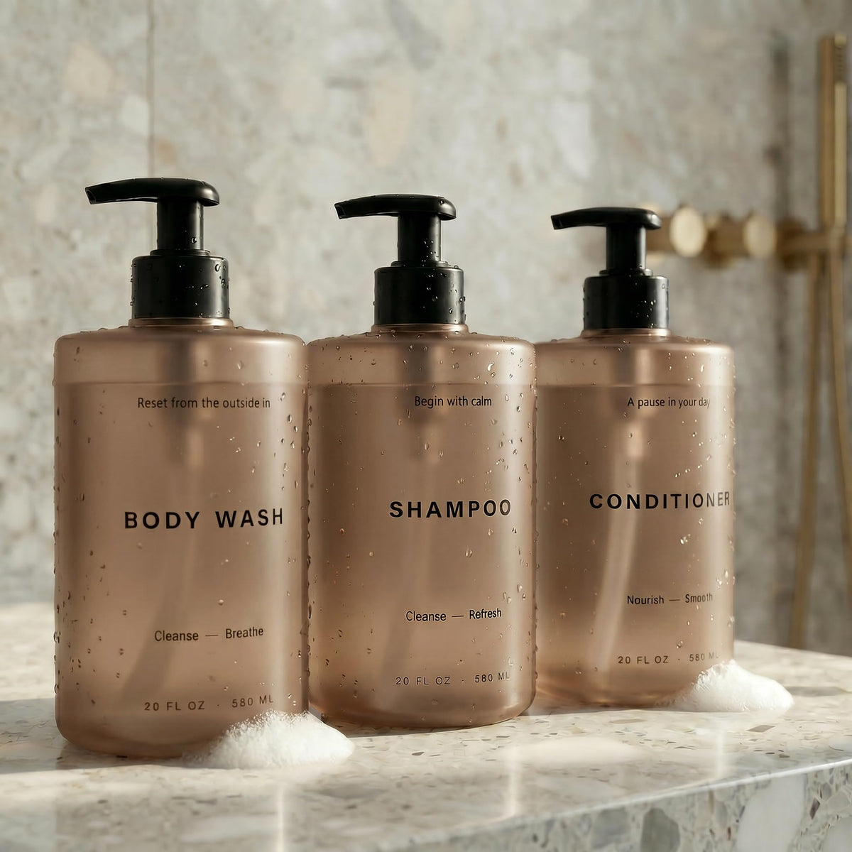 KIBAGA 3-piece dispenser set with 20oz bottles for elegant bathroom organization.