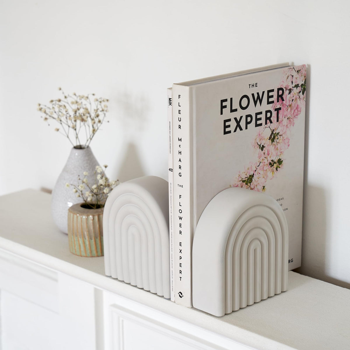 KIBAGA concrete bookends support heavy volumes with a sturdy non-slip base.