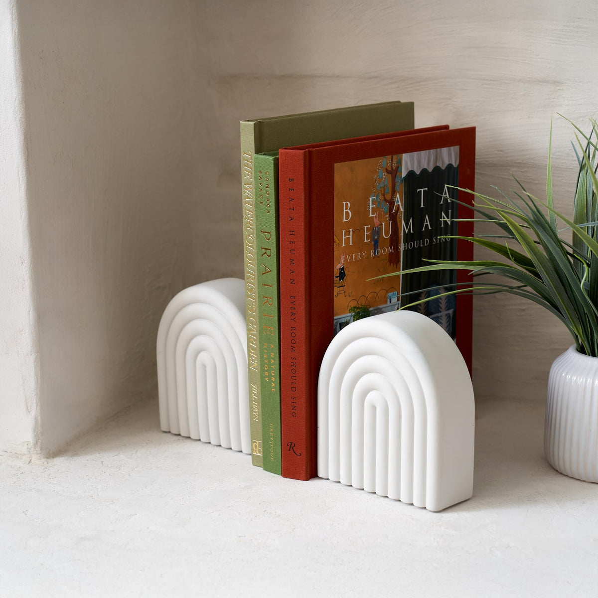 KIBAGA concrete bookends in light gray finish complement modern decor.