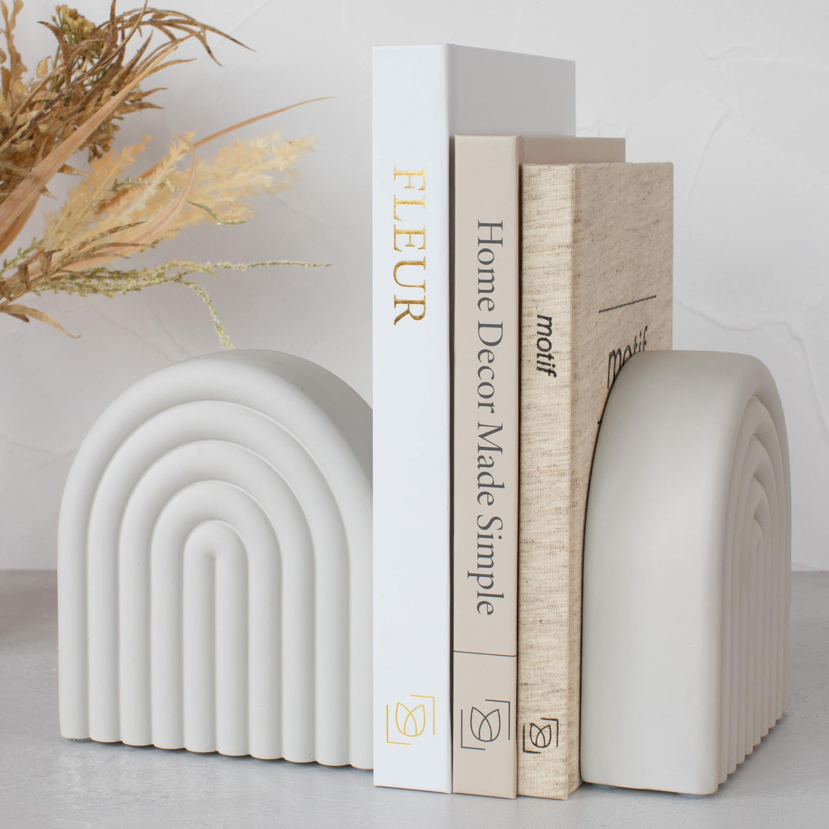 KIBAGA concrete bookends with rainbow arch provide stylish shelf organization.