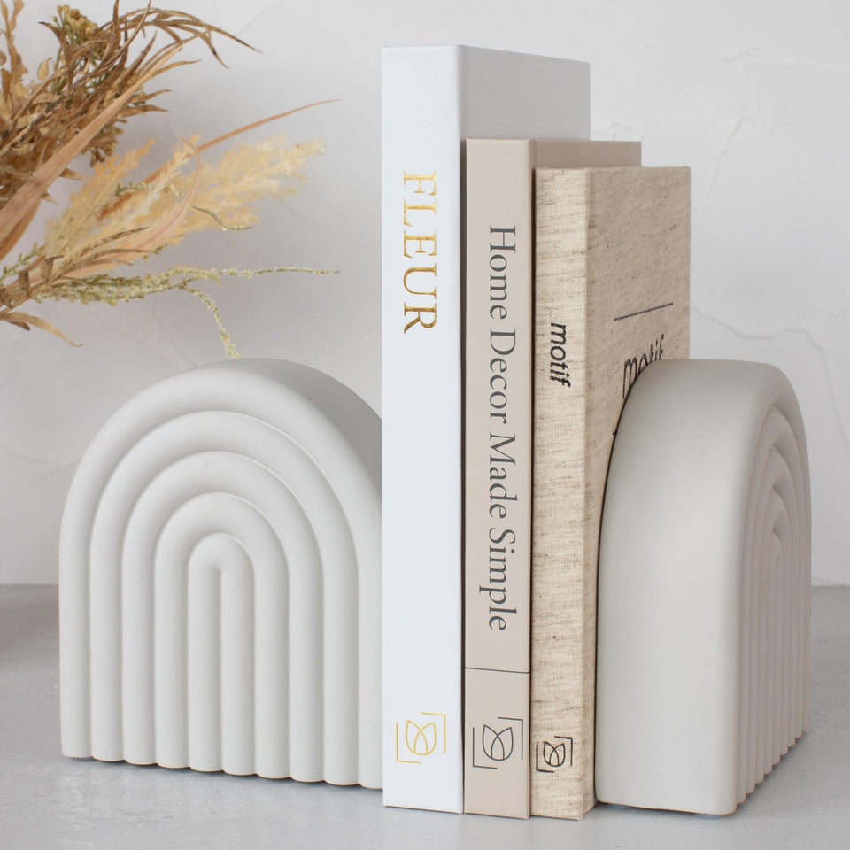 KIBAGA concrete bookends with rainbow arch provide stylish shelf organization.