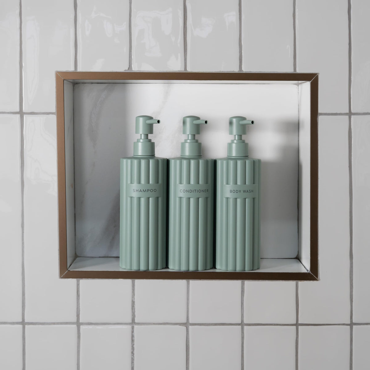 KIBAGA fluted conditioner dispenser for mess-free bathroom organization.