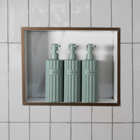 KIBAGA fluted conditioner dispenser for mess-free bathroom organization.
