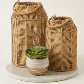 KIBAGA natural jute lantern large casts warm patterns on the coffee table