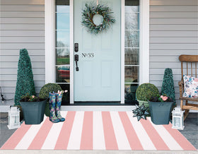 KIhipIoe farmhouse outdoor rug helps outdoor decor feel cohesive and inviting.