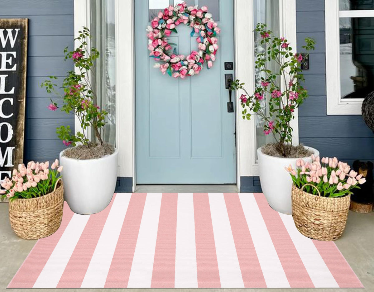 KIhipIoe pink and white striped outdoor rug 3x5 enhances porch curb appeal and is easy to clean.