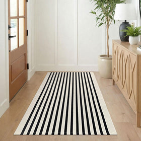 KILOCOCO Beige striped rug 3x5 creates a layered look under doors.