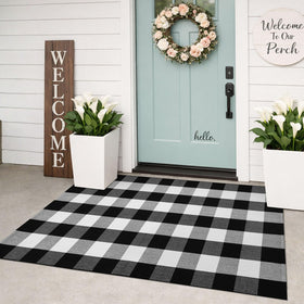 KILOCOCO buffalo plaid rug at the front door enhances curb appeal while protecting floors.