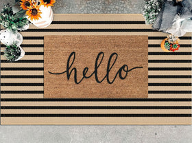 KILOCOCO brown-black striped rug on doorway adds warm, welcoming style.