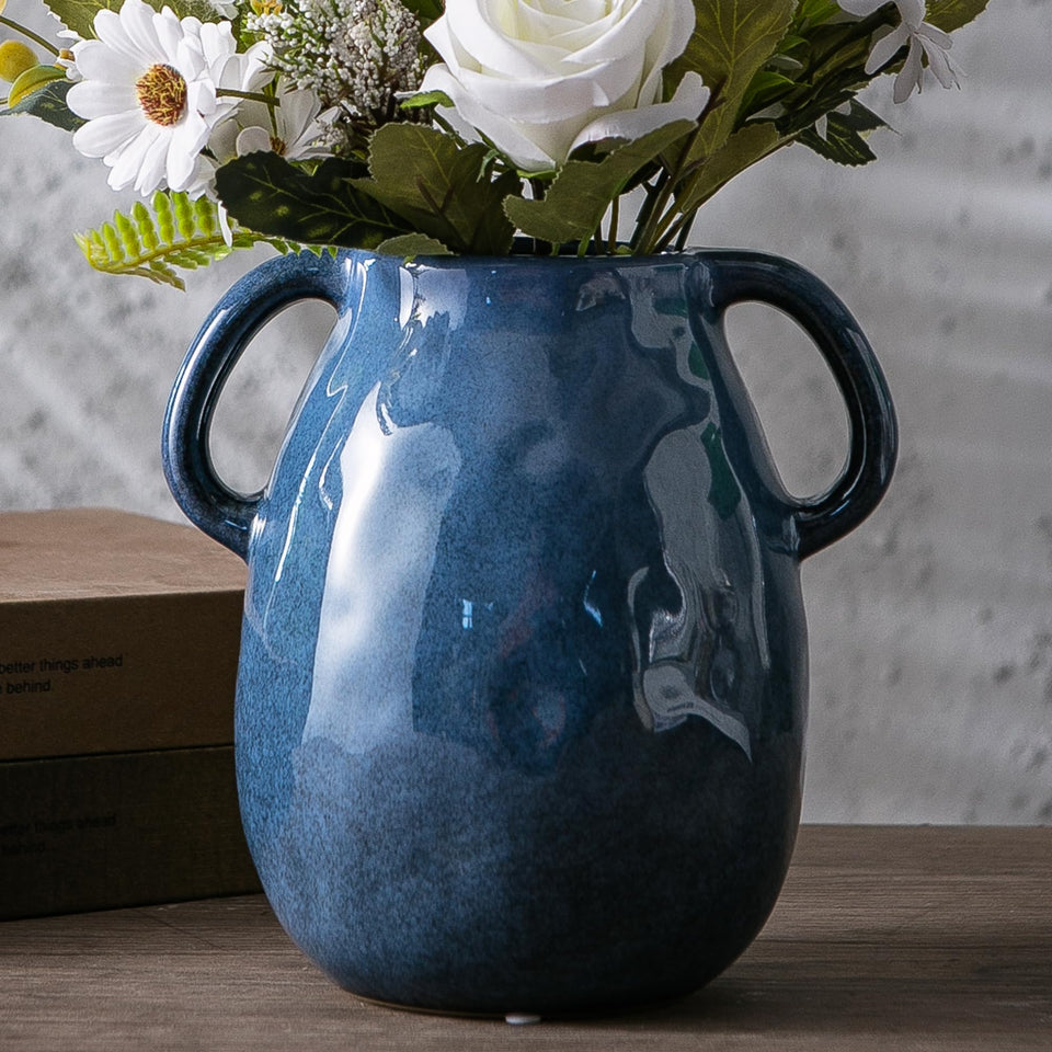 Kimdio blue ceramic vase with two handles, ideal as a sturdy centerpiece.