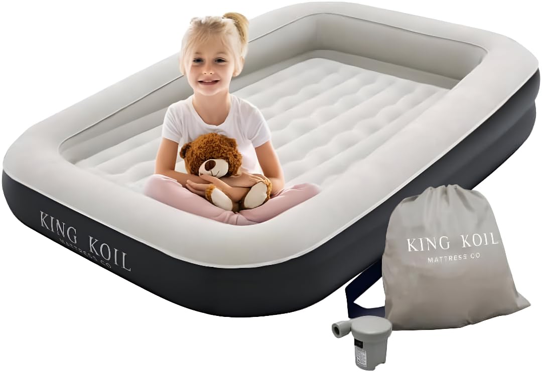 King Koil toddler travel bed with built-in bumper for secure, cozy sleep on family trips.