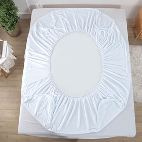 Kingnex bed protector in use shows practical protection during travel.