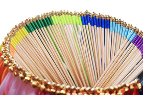 Kingsnow wedding send-off wands create a rainbow canopy of color.