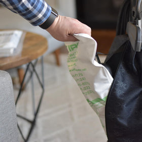 Kirby Micron Magic HEPA bags being inserted into a Kirby G-series model.
