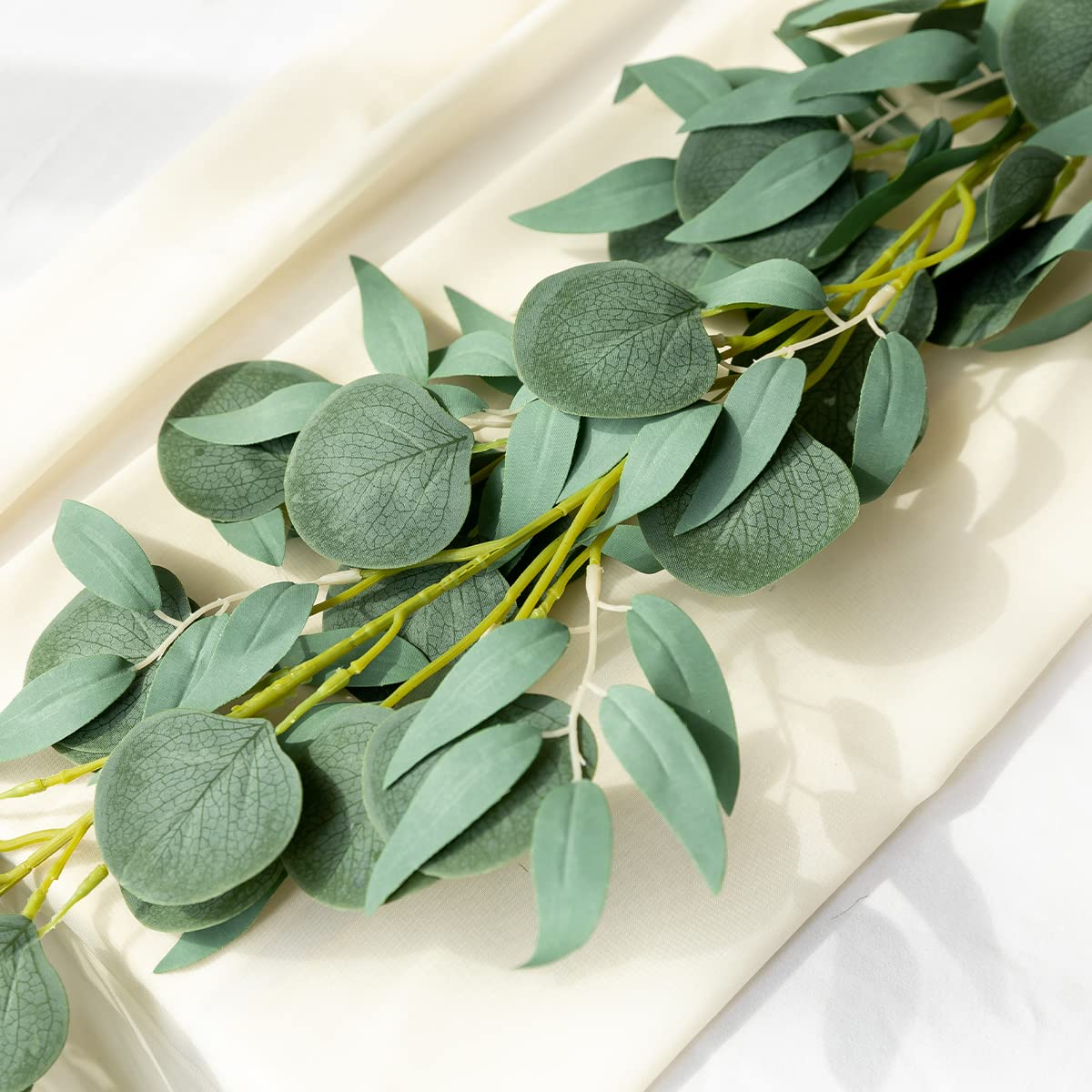 Kisflower garland serves as table centerpiece with vibrant greenery accents