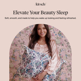 Kitsch Bridgerton lifestyle shot showcasing the Wisteria vibe on a bed.
