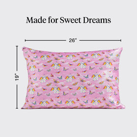 Kitsch Lisa Frank pillowcase on bed demonstrates wrinkle-free, stay-in-place design.